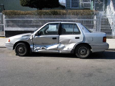 busted up hoopy car.
